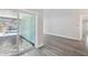 Light-filled living room with stylish gray floors and a view of the outdoor pool at 4482 Kingston Dr, Hernando Beach, FL 34607