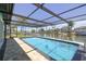 Gorgeous screened pool with views of the canal and dock, providing a perfect outdoor oasis at 4482 Kingston Dr, Hernando Beach, FL 34607
