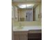 Bathroom featuring a large mirror, vanity and cabinet storage at 4529 Keelboat Pl, New Port Richey, FL 34652