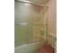 Full bathroom with sliding glass door and a shower and tub combo at 4529 Keelboat Pl, New Port Richey, FL 34652
