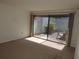 Cozy living room with sliding glass doors opening to a private patio at 4529 Keelboat Pl, New Port Richey, FL 34652