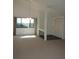 Bright living room featuring plush carpet, a large window with natural light, and high ceilings at 4529 Keelboat Pl, New Port Richey, FL 34652