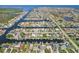 Picturesque aerial view showcasing waterfront homes with canals and boat docks in a beautiful neighborhood at 4942 Blue Heron Dr, New Port Richey, FL 34652