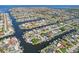Stunning aerial view of waterfront homes with boat docks and canals in a vibrant community at 4942 Blue Heron Dr, New Port Richey, FL 34652