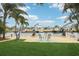 Inviting backyard with manicured lawn, waterfront access, and cozy seating area by the canal at 4942 Blue Heron Dr, New Port Richey, FL 34652