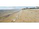 Sandy beach with shallow water, perfect for a relaxing day at 4942 Blue Heron Dr, New Port Richey, FL 34652