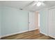 Bright, unfurnished bedroom with closet and access to other rooms at 4942 Blue Heron Dr, New Port Richey, FL 34652