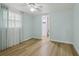 Serene bedroom with wood-look floors and an ensuite bathroom, providing comfort and privacy at 4942 Blue Heron Dr, New Port Richey, FL 34652