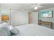 Light, bright bedroom with a ceiling fan, closet, and TV for relaxation at 4942 Blue Heron Dr, New Port Richey, FL 34652