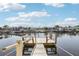 Beautiful waterfront dock with bench and ladder, providing serene canal views and easy access at 4942 Blue Heron Dr, New Port Richey, FL 34652