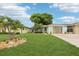 Charming single-story home with a well-manicured lawn and tropical landscaping at 4942 Blue Heron Dr, New Port Richey, FL 34652