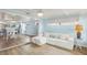 Cozy living room with hardwood floors, neutral tones and easy access to the kitchen at 4942 Blue Heron Dr, New Port Richey, FL 34652
