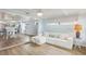 Comfortable living room next to the dining area with coastal decor, great natural light, and a relaxed ambiance at 4942 Blue Heron Dr, New Port Richey, FL 34652