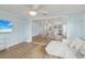 Spacious living room offering hardwood floors, bright paint, and easy access to the kitchen at 4942 Blue Heron Dr, New Port Richey, FL 34652