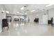 A large open meeting space with tables, chairs, and an American flag at 4942 Blue Heron Dr, New Port Richey, FL 34652