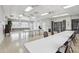 A bright meeting room with folding tables and chairs, perfect for events at 4942 Blue Heron Dr, New Port Richey, FL 34652