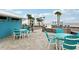 Community patio area with multiple seating areas near sandy beach and Gulf at 4942 Blue Heron Dr, New Port Richey, FL 34652