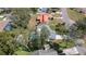 Aerial view of home with pool and backyard shed in a tree filled neighborhood at 5309 Bayonne Ave, Spring Hill, FL 34608