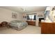 Bright bedroom featuring a ceiling fan, neutral carpeting, and tasteful decor for a relaxing retreat at 5309 Bayonne Ave, Spring Hill, FL 34608