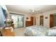 Bedroom features a ceiling fan and access to an outdoor patio, providing a seamless indoor-outdoor flow at 5309 Bayonne Ave, Spring Hill, FL 34608