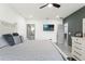 Spacious bedroom with attached bath and tv, featuring clean decor and ample natural light at 5328 Baldock Ave, Spring Hill, FL 34608
