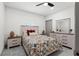 Comfortable bedroom with a decorative bedspread, coordinating nightstands, and a spacious dresser with a mirror at 5328 Baldock Ave, Spring Hill, FL 34608