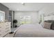 Large bedroom with recessed lighting, neutral decor, a ceiling fan, and a large window at 5328 Baldock Ave, Spring Hill, FL 34608