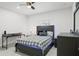Cozy bedroom with a gray accent and modern furniture at 5328 Baldock Ave, Spring Hill, FL 34608