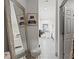 Hallway view features a large framed mirror and a bedroom suite beyond the doorway at 5328 Baldock Ave, Spring Hill, FL 34608
