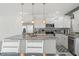Updated kitchen with granite countertops, stainless steel appliances, and pendant lighting at 5328 Baldock Ave, Spring Hill, FL 34608