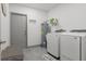 Laundry room with a washer, dryer, storage, and laundry sink for added convenience at 5328 Baldock Ave, Spring Hill, FL 34608