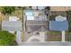 An aerial view of the home and property showcasing the backyard oasis with a pool and outdoor entertaining space at 5330 Dove Dr, New Port Richey, FL 34652