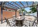 Relax in this backyard with pergola, fire pit, and a refreshing swimming pool for outdoor enjoyment at 5330 Dove Dr, New Port Richey, FL 34652