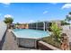 The home includes a refreshing above ground pool, screen enclosed patio, and lush tropical landscaping at 5330 Dove Dr, New Port Richey, FL 34652