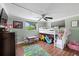 A playful bedroom with a bunk bed, colorful rug, and ample play space at 5330 Dove Dr, New Port Richey, FL 34652