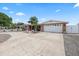 Charming ranch-style home featuring a spacious driveway and an attached two-car garage at 5330 Dove Dr, New Port Richey, FL 34652