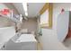 A functional laundry room with shelving, storage, and essential appliances at 5330 Dove Dr, New Port Richey, FL 34652