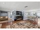 Open-concept living and dining area with stylish decor and modern fireplace at 5330 Dove Dr, New Port Richey, FL 34652
