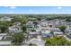 Aerial view of the property highlighting a desirable neighborhood with mature trees and a convenient location at 5330 Dove Dr, New Port Richey, FL 34652