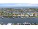Aerial view of waterfront homes with docks, boats, and easy access to the ocean at 5340 Pilots Pl, New Port Richey, FL 34652