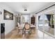 Bright dining room with travertine floors, view of pool, sliding door to backyard, and elegant decor at 5340 Pilots Pl, New Port Richey, FL 34652