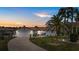 Charming home featuring a well-manicured lawn, mature trees, and a two-car garage, perfect for curb appeal at 5340 Pilots Pl, New Port Richey, FL 34652