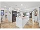 Bright and modern kitchen with an island, new appliances and tile flooring at 5340 Pilots Pl, New Port Richey, FL 34652