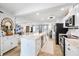 Bright, renovated kitchen boasts an island, stainless appliances, and an open floor plan at 5340 Pilots Pl, New Port Richey, FL 34652