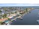 Stunning aerial view of waterfront homes with private docks and boats docked along canals at 5340 Pilots Pl, New Port Richey, FL 34652