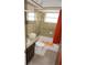 A bathroom featuring a tiled shower/tub, sink and toilet at 5636 Dolores Dr, Holiday, FL 34690