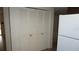 Hallway with white closet doors and view into living areas at 5636 Dolores Dr, Holiday, FL 34690