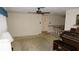 Cozy living room with natural light, neutral walls, and vintage decor at 5636 Dolores Dr, Holiday, FL 34690