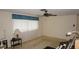 Cozy living room with natural light, neutral walls, and vintage decor at 5636 Dolores Dr, Holiday, FL 34690