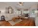 Inviting living room featuring hardwood floors, neutral decor, and ample natural light for comfortable living at 6207 Main St, New Port Richey, FL 34653